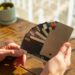 a person holding a credit card in their hand