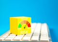 Yellow cube with risk meter on keyboard