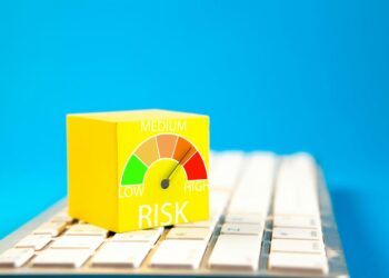 Yellow cube with risk meter on keyboard